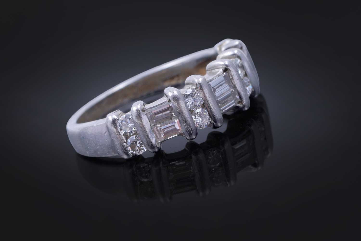 Lot 82 - A diamond half hoop eternity ring