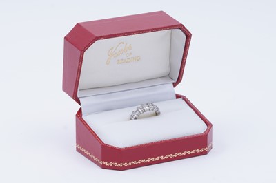 Lot 82 - A diamond half hoop eternity ring