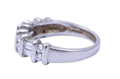 Lot 82 - A diamond half hoop eternity ring