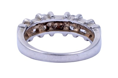 Lot 82 - A diamond half hoop eternity ring