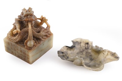 Lot 348 - A Chinese soapstone seal; and a leaf dish
