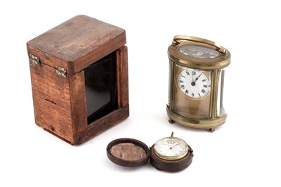 Lot 163 - An early 20th Century French brass 30-hour carriage timepiece and a pocket barometer