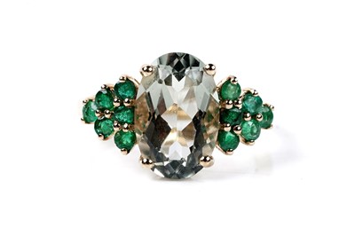 Lot 106 - A contemporary green spinel and emerald ring
