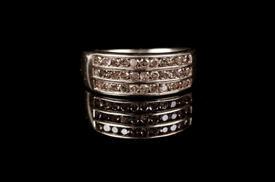 Lot 110 - A contemporary champagne diamond half-hoop eternity ring