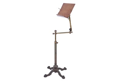Lot 528 - A Victorian cast iron, brass and walnut music stand