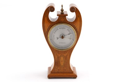 Lot 165 - The Stereoscopic Co: an Art Nouveau oak table barometer