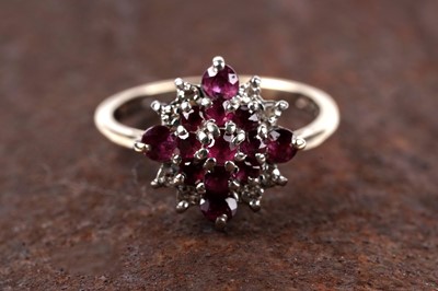 Lot 112 - A 20th Century ruby and diamond cluster ring
