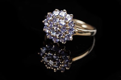 Lot 114 - A contemporary tanzanite cluster ring