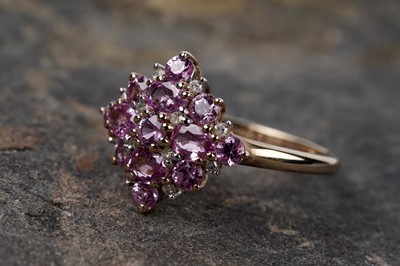 Lot 115 - A pink sapphire and diamond cluster ring