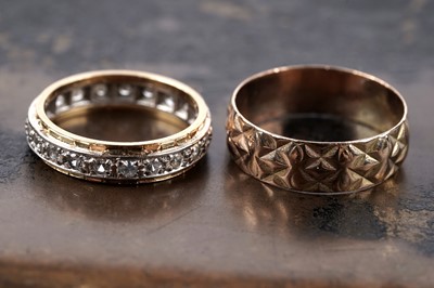 Lot 128 - An 18ct gold and white topaz eternity ring, and a Slade and Wolfe "Lucky" 9ct gold ring