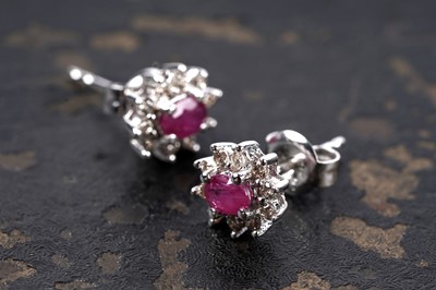 Lot 131 - A pair of ruby and diamond stud earrings