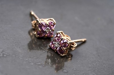 Lot 132 - A pair of pink sapphire and diamond stud earrings