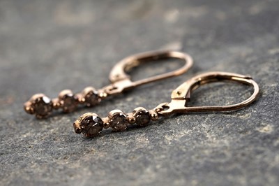 Lot 133 - A contemporary pair of champagne diamond pendant earrings