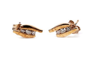 Lot 135 - A contemporary pair of champagne diamond stud earrings