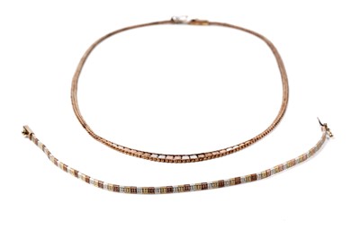 Lot 138 - A 20th Century tri-coloured gold necklace and bracelet