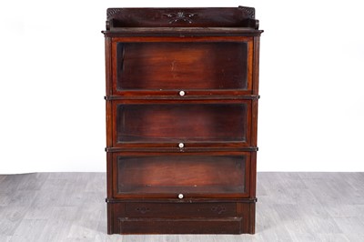 Lot 57 - A 20th Century mahogany three-section bookcase