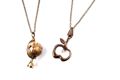 Lot 144 - Two 9ct gold novelty pendants on chain