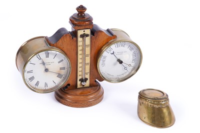 Lot 536 - An early 20th Century brass cased clock and barometer desk compendium; and an inkwell