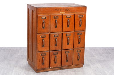 Lot 31 - An early 20th Century oak veneered haberdashery cabinet