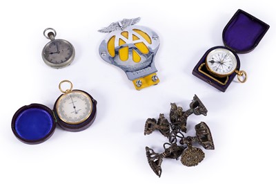 Lot 530 - A cased Negretti and Zambra compensated barometer; and others