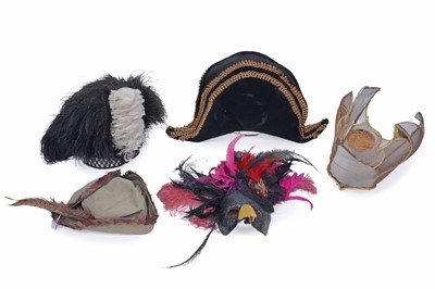 Lot 404 - Four hats; and a mask