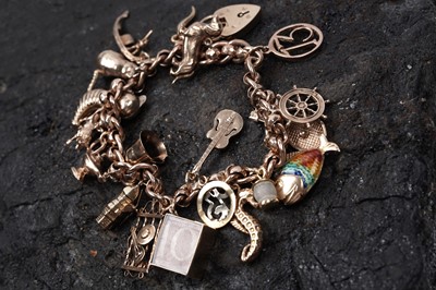 Lot 53 - A 9ct rose gold fancy-link charm bracelet