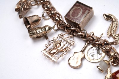 Lot 53 - A 9ct rose gold fancy-link charm bracelet