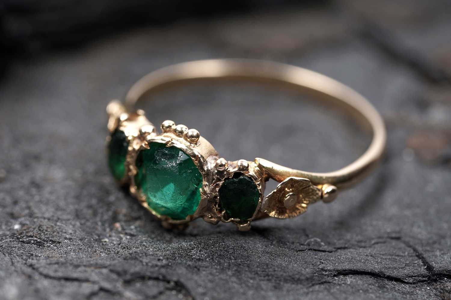 Lot 62 - A Victorian green paste three stone ring