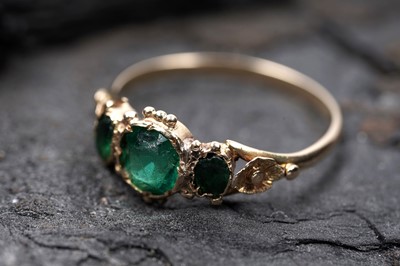 Lot A Victorian green paste three stone ring