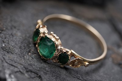 Lot 62 - A Victorian green paste three stone ring