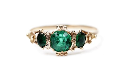 Lot 62 - A Victorian green paste three stone ring
