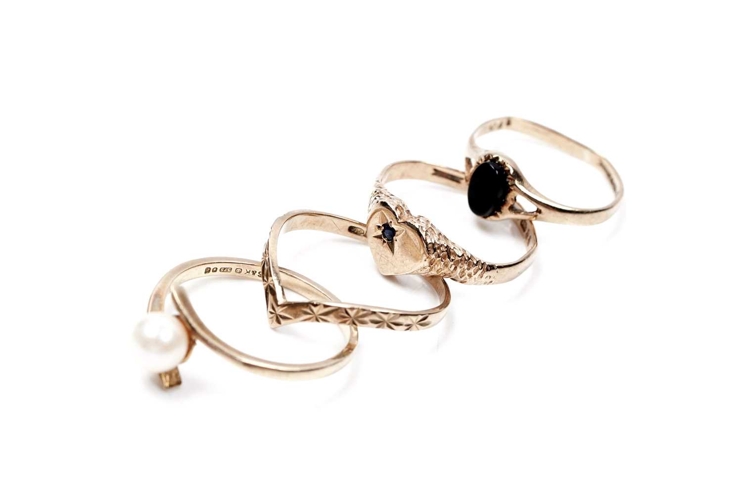 Lot 64 - Four 9ct gold rings, including a wishbone ring