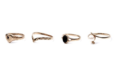 Lot 64 - Four 9ct gold rings, including a wishbone ring