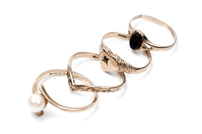 Lot 64 - Four 9ct gold rings, including a wishbone ring