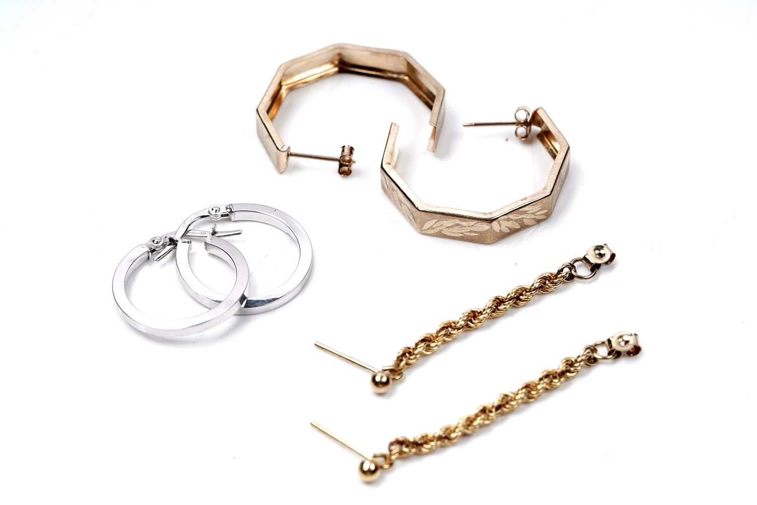 Lot 67 - Three pairs of gold hoop earrings