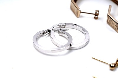 Lot 67 - Three pairs of gold hoop earrings