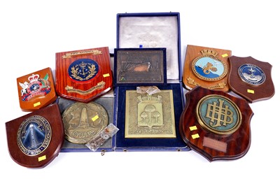 Lot 583 - A collection of ships tampions; and three plaques