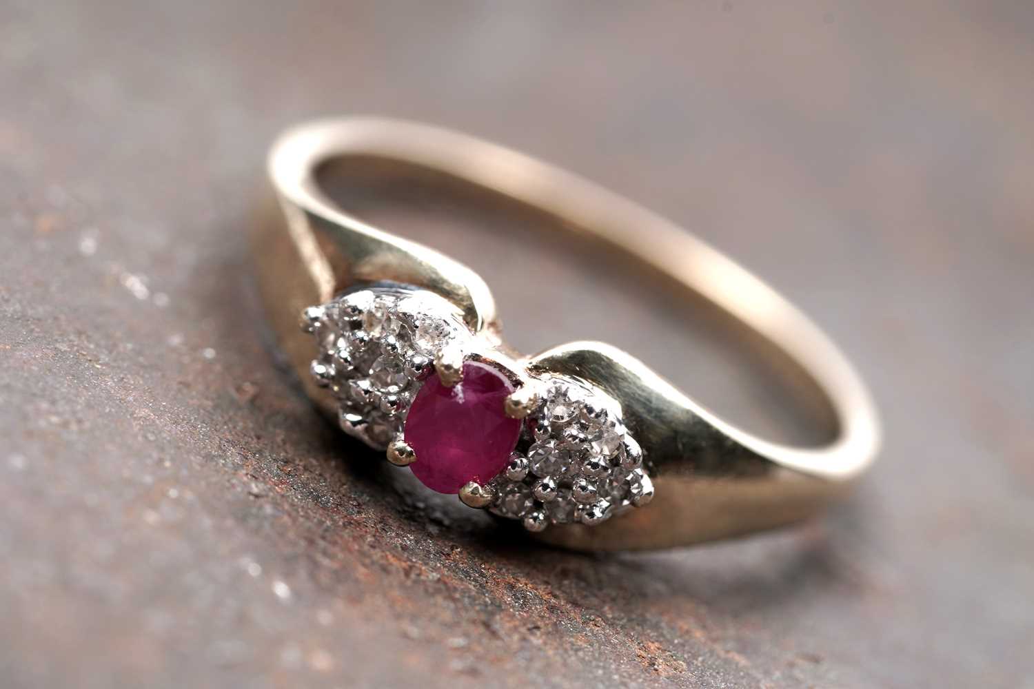 Lot 93 - A ruby and diamond bow pattern ring