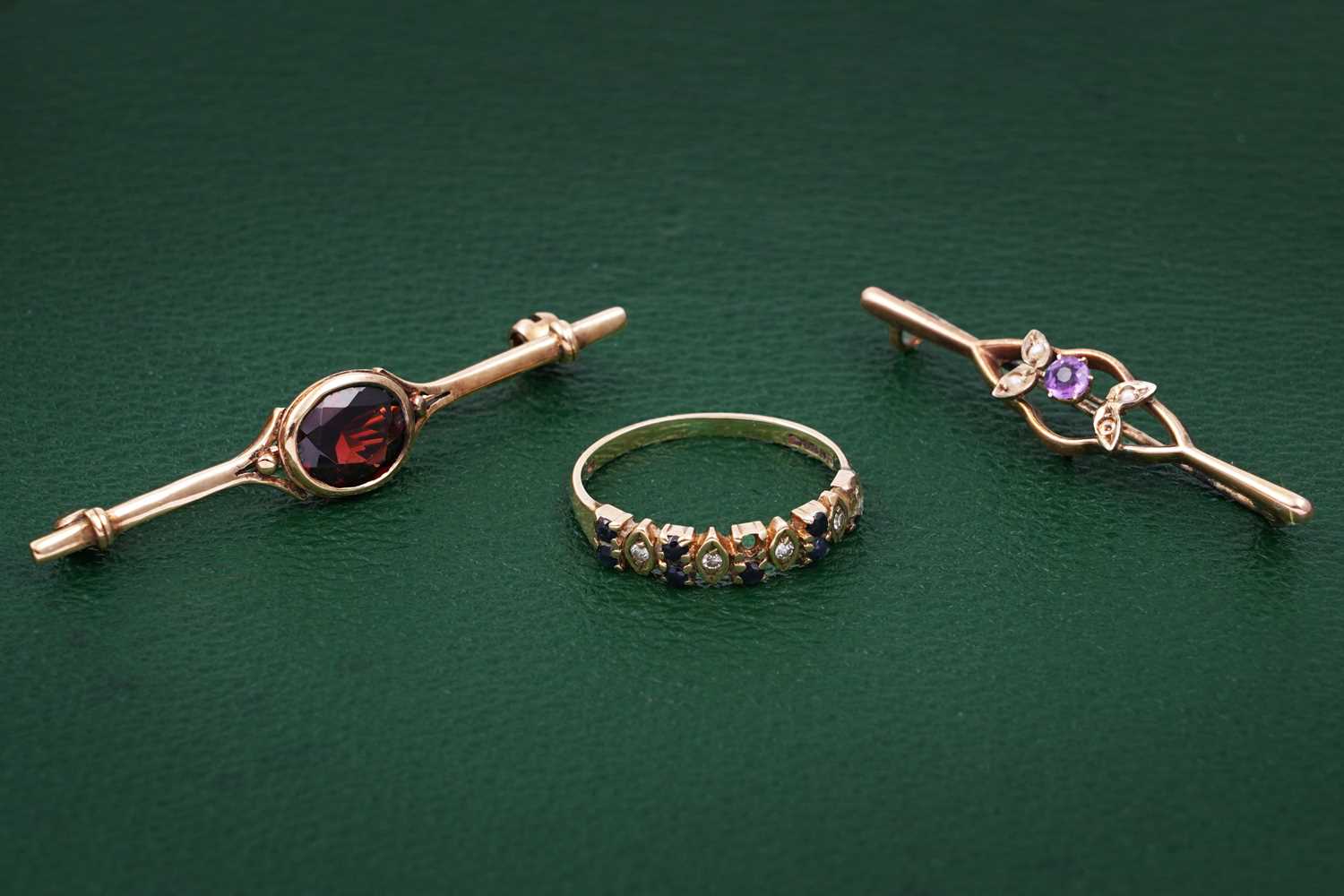 Lot 99 - Edwardian and later brooches; and a ring