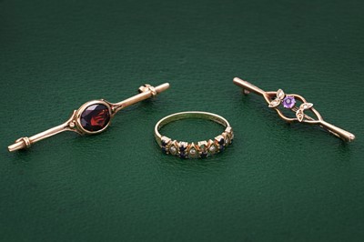 Lot 99 - Edwardian and later brooches; and a ring