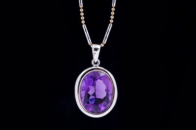 Lot 101 - A contemporary amethyst pendant on chain