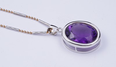 Lot 101 - A contemporary amethyst pendant on chain