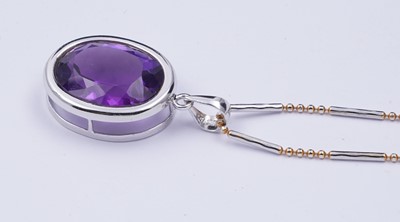 Lot 101 - A contemporary amethyst pendant on chain
