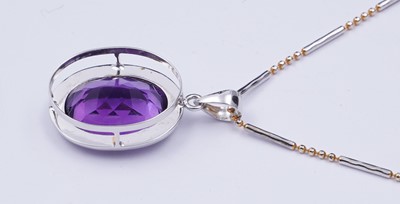 Lot 101 - A contemporary amethyst pendant on chain