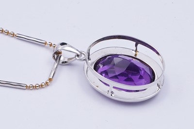 Lot 101 - A contemporary amethyst pendant on chain