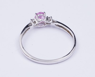Lot 73 - A pink sapphire and diamond ring