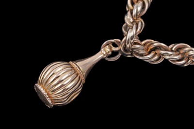 Lot 32 - A gold rope-twist charm bracelet