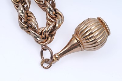 Lot 32 - A gold rope-twist charm bracelet