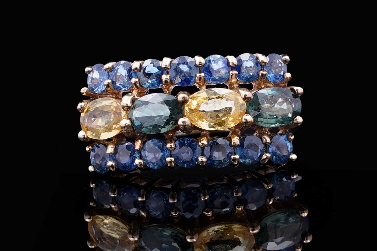 Lot 37 - A topaz and citrine dress ring