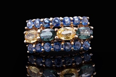 Lot 37 - A topaz and citrine dress ring